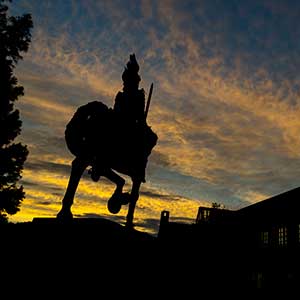 Knight statue at sunset