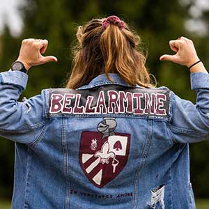 back of a student's jean jacket with Bellarmine painted on it